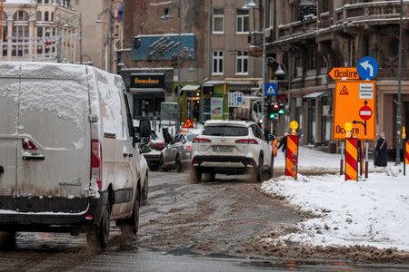 Morning traffic congestion with cars on snowy roads in Bucharest Romania during winter