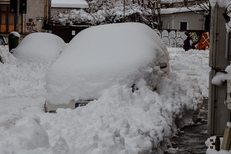 City covered in snow after a heavy snowfall. Urban scene during winter