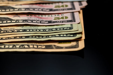 American Dollar banknotes representing economy and inflation in the United States. US dollar...