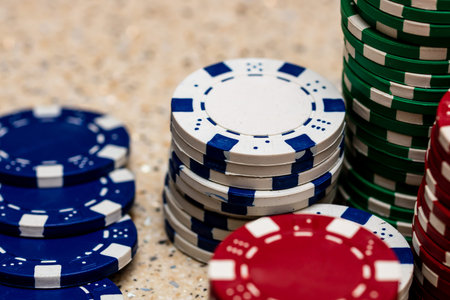 Detail of poker chips used for betting and wagering in a game of chance