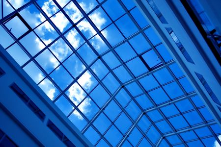 Blue unusual geometric ceiling in office buildingの写真素材