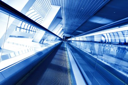 Moving escalator with stairs in airportの写真素材