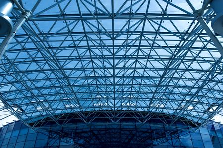 Abstract blue geometric ceiling in office centerの写真素材
