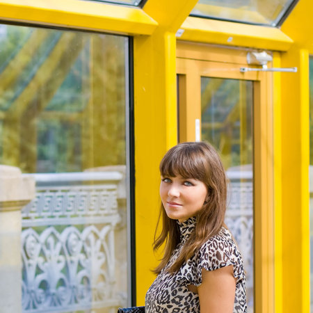 Beautiful confident businesswoman indoor glass corridor
