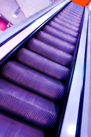 violet escalator with stairs in airportの写真素材
