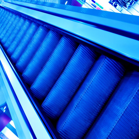 blue footsteps of moving escalator in office center
