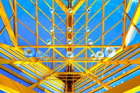 Yellow abstract ceiling in office centerの写真素材