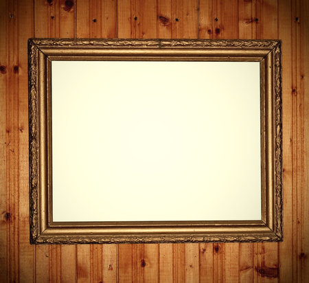 Empty frame over wood wall