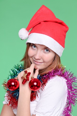cute young girl with christmas ballsの写真素材