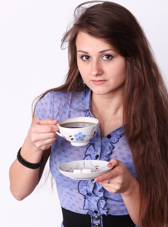 Beautiful brunette lady drinking bracing coffeeの写真素材