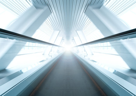 wide angle of moving symmetric escalator inside contemporary airportの写真素材