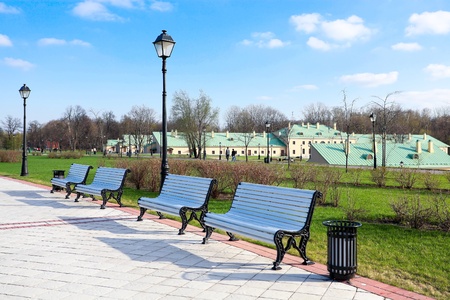 white benches in summer parkの写真素材
