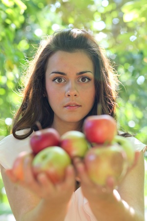 gorgeous young girl with sappy applesの写真素材