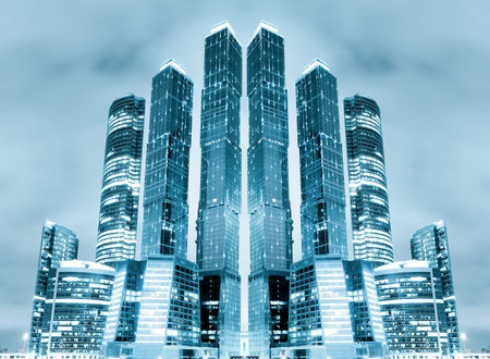 perspective view to glass high-rise building skyscrapers at nigh
