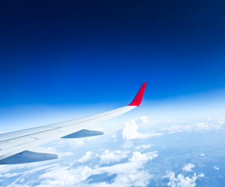 Classic image through aircraft window onto jet engineの写真素材