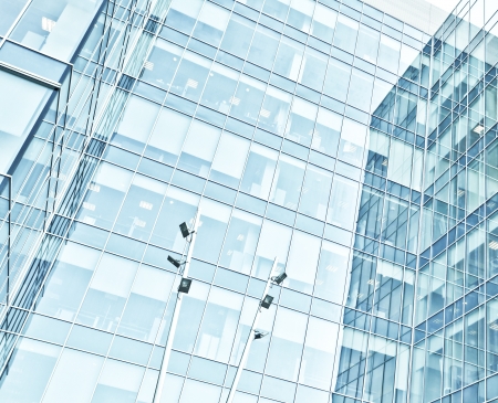 Panoramic and perspective wide angle view to steel blue background of glass high rise building skyscrapers in modern futuristic downtown at night
Business concept of successful industrial architectureの写真素材