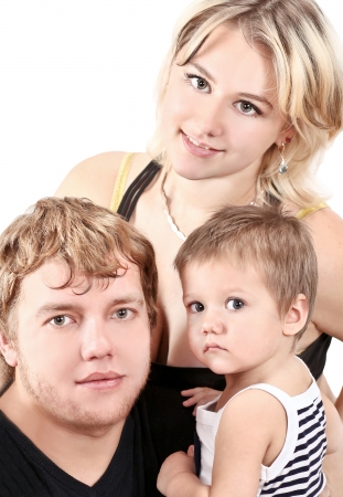Father, mother and his sweet little daughter and son on a white background. Happy family.の写真素材