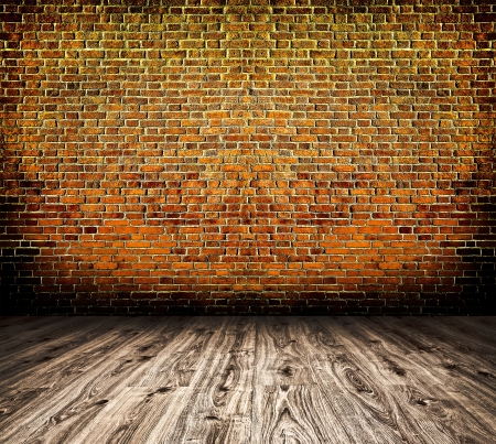 Empty black old spacious room with stone grungy wall and wooden weathered dirty floor, vintage background texture of brickwallの写真素材