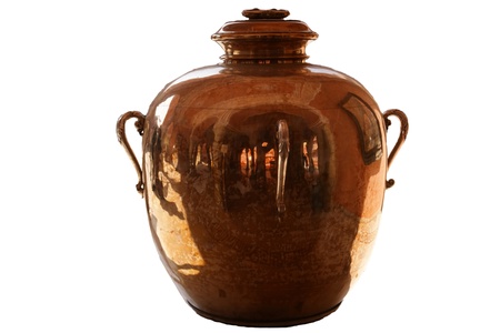 The big ancient copper jug separately on a white backgroundの写真素材