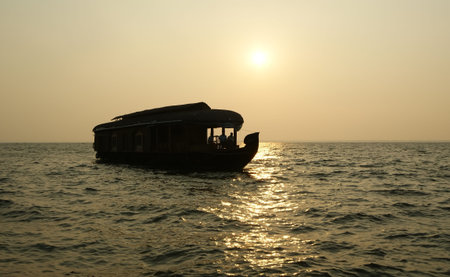 House boat in the Kerala (India) Backwaters. Used to carry rice in the olden days. Now primarily used as houseboats. の写真素材