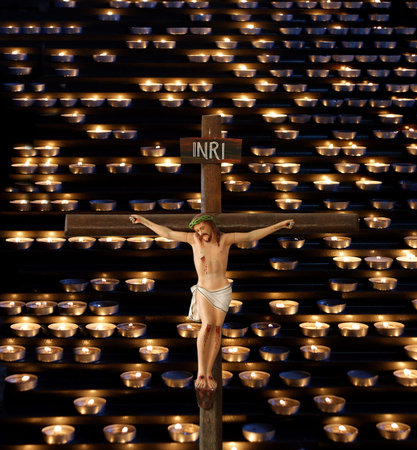 Jesus Crucifixion against the background of church candles