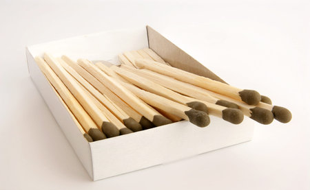 Big matches with brown heads closeup on white backgroundの写真素材