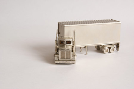 steel-colored truck with a trailer on a white background
