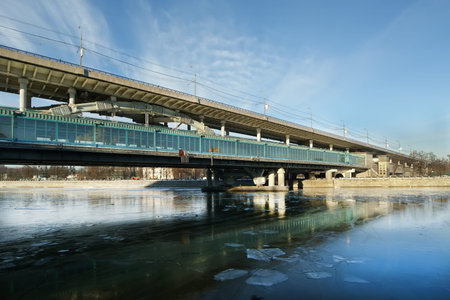 Moscow River, Luzhnetskaya Bridge (Metro Bridge) and promenade on a clear winter day. Moscow, Russia