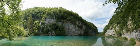 panorama of a landscape consisting of mountains and lake の写真素材