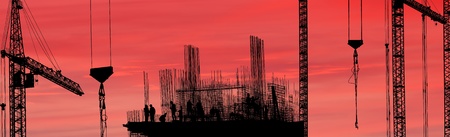 Construction workers silhouette against the sunset., panoramaの写真素材