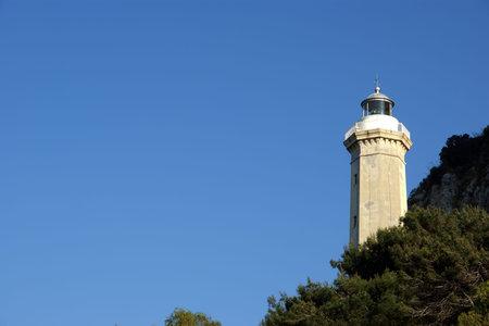 Lighthouse on the coast of the Mediterranean Sea, Sicily, Italyの写真素材