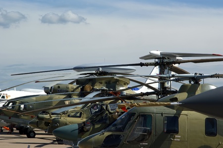 A number of modern military helicopters in the parking lotのeditorial素材