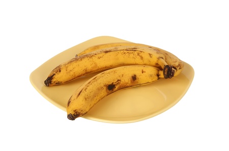 A bunch of bananas on a plate. Isolated on whiteの写真素材