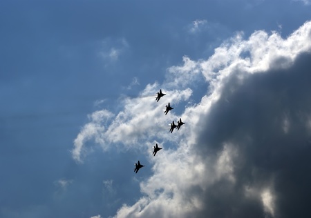 Flight of modern combat fighters on the sky backgroundのeditorial素材