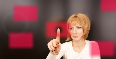 Woman touching a business card or something else on Transparent Digital Touch Screen.の写真素材