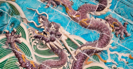 Dragon sculpture. The Nine-Dragon Wall (Jiulongbi) at Beihai park, Beijing, China. The wall was built in 1756 CEの写真素材