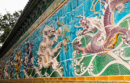 Dragon sculpture. The Nine-Dragon Wall (Jiulongbi) at Beihai park, Beijing, China. The wall was built in 1756 CEの写真素材