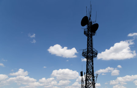 Communication transmitter against a sky background