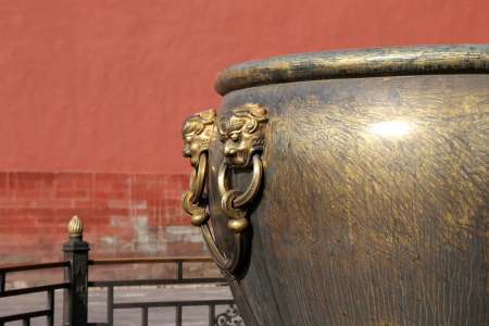 Large bronze bowl to extinguish fire with image Chinese dragon statue in the Forbidden City. Beijing, Chinaの写真素材