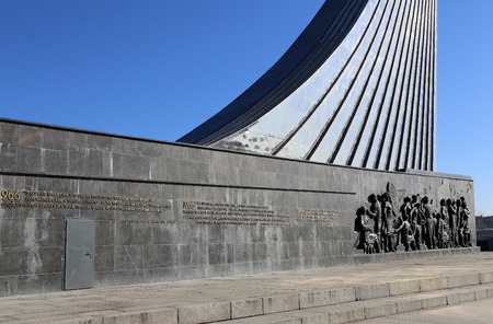 Detail from the titanium obelisk representing the Soviet succes dream, featuring scientists and engineers hard at work. Monument of Sovjet space flight, near VDNK exhibition center, Moscow, Russiaのeditorial素材