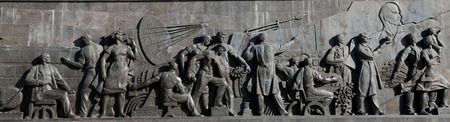 Detail from the titanium obelisk representing the Soviet succes dream, featuring scientists and engineers hard at work. Monument of Sovjet space flight, near VDNK exhibition center, Moscow, Russiaのeditorial素材