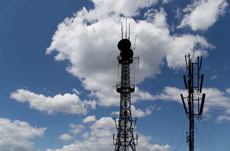 silhouette communicatios tower  against the sky