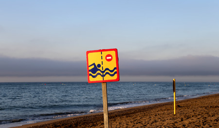 Prohibiting sign on the beach. Costa del Sol (Coast of the Sun), Malaga in Andalusia, Spain の写真素材