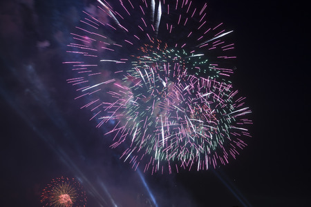 Celebratory colorful fireworks exploding in the skies.の写真素材