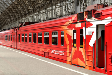 Aeroexpress red Train on Kiyevskaya railway station  (Kiyevsky railway terminal,  Kievskiy vokzal) -- is one of the nine main railway stations of Moscow, Russiaのeditorial素材