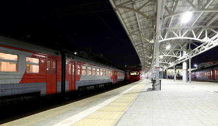 Train on Moscow passenger platform at night (Belorussky railway station) is one of the nine main railway stations in Moscow, Russia. It was opened in 1870 and rebuilt in its current form in 1907-1912のeditorial素材