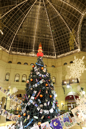 Interior Main Universal Store (GUM) in the Christmas (New Year) holidays, Red Square, Moscow, Russia. Inscriptions in Russian GUM and Happy New Yearのeditorial素材
