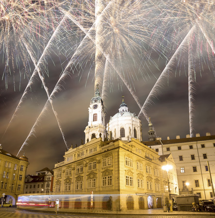 Church of St. Nicholas (Night view ) in the quarter of Mala Strana in Prague and holiday fireworks, Czech Republicの写真素材