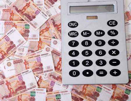 Close-up of russian banknotes (Five Thousand Ruble Notes) and calculatorの写真素材