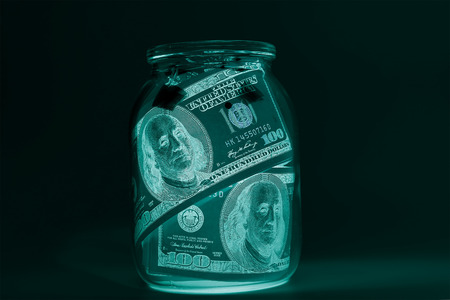One hundred dollar bills (banknotes )  close up, U.S. currency-- in UV light protectionの写真素材